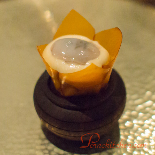 Another, elevated view of the pork and oyster canape